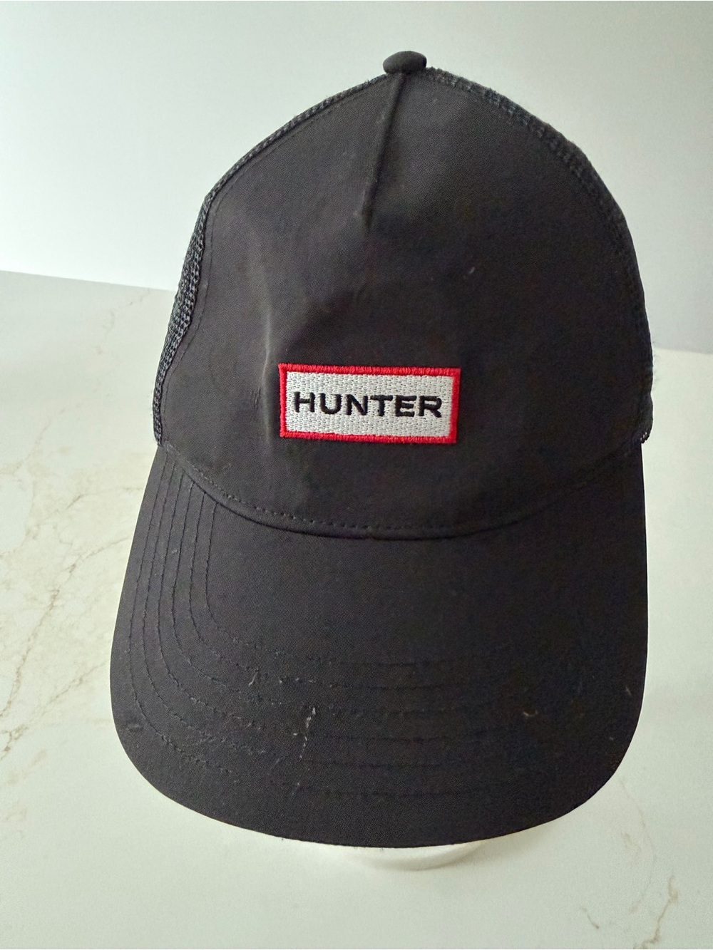Hunter Black Mesh Trucker Hat with iconic logo
